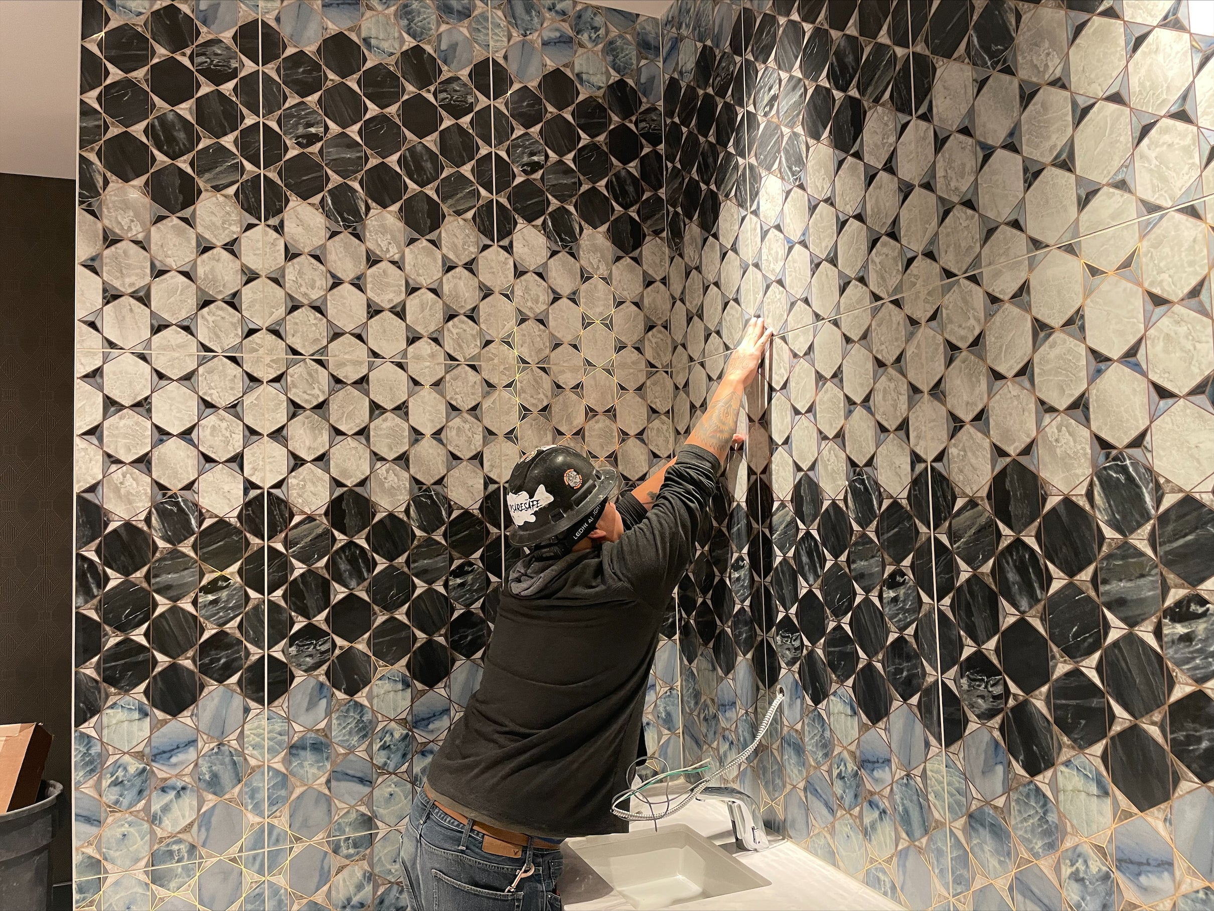 Rich Valenzuela inspects tile