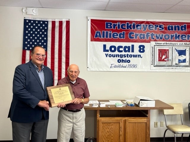 BAC Local 8 Ohio 75-year member Joseph DeFuria receiving his service award from Local 8 President Lee Kurtz. 