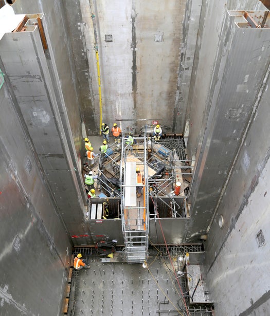 Members pouring concrete inside a unit. Photo: Southern Company