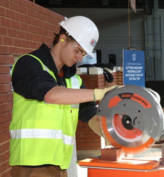 Demonstration at the BAC/IMI International Training Center of a masonry saw with integrated dust collection from IQ Power Tools. This is an example of masonry equipment designed to help eliminate silica dust and meet the OSHA Silica Standard when properly implemented.